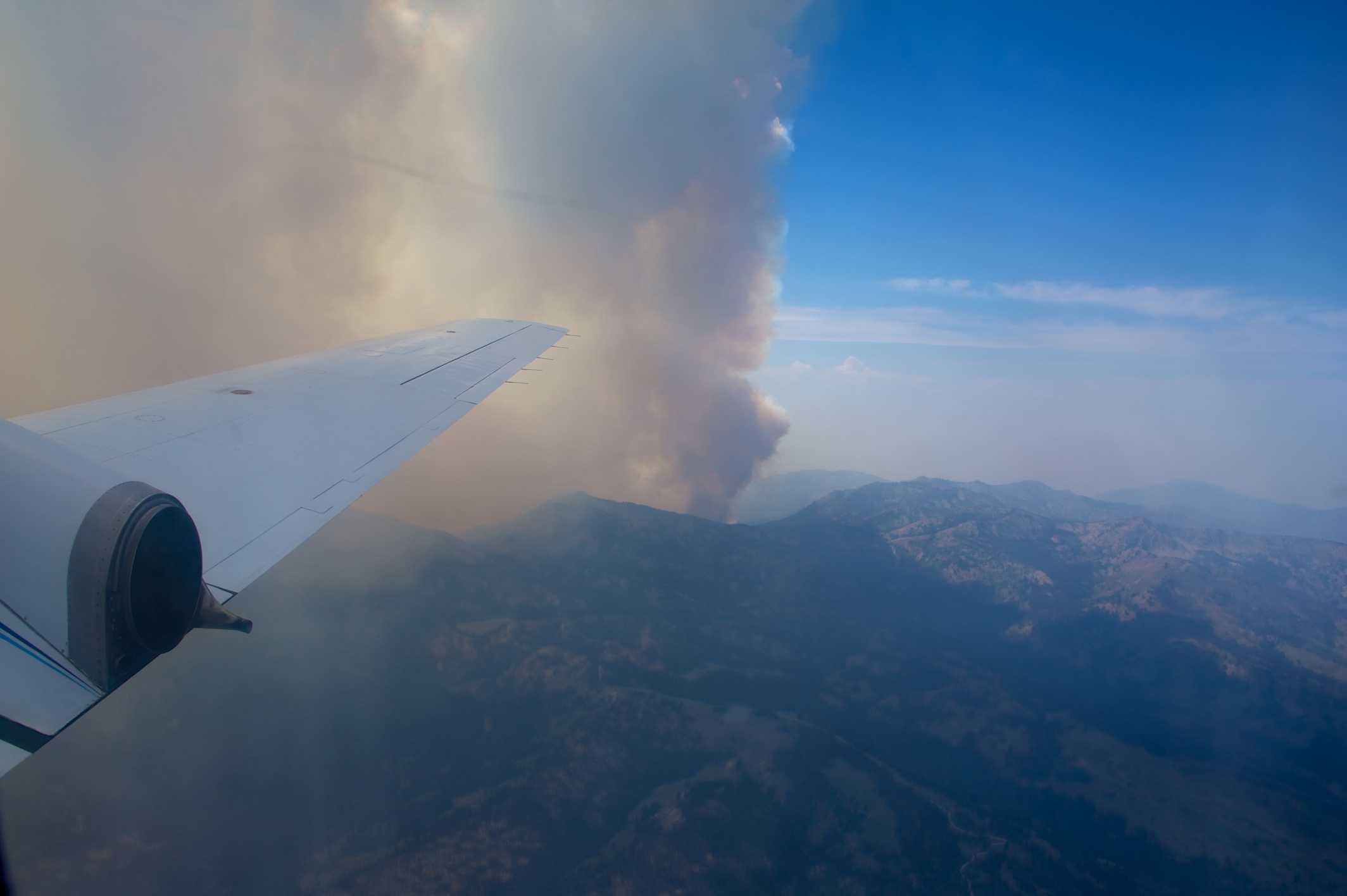 A smoke plume arises from a wildfire during ARM’s 2013 Biomass Burning Observation Project (BBOP), which continues to inspire laboratory (and other) studies.