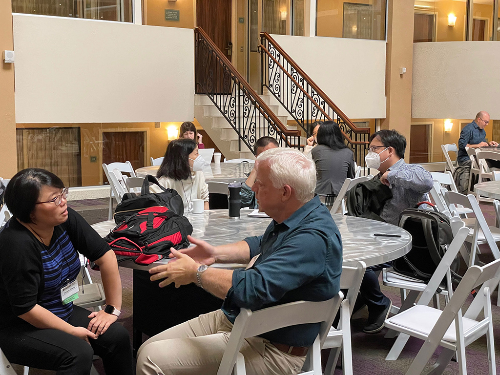 Yunyan Zhang (left) of Lawrence Livermore National Laboratory in California is deep in discussion with Jerome Fast of Pacific Northwest National Laboratory.